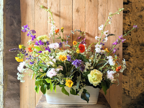 A vibrant hand-crafted floral arrangement featuring seasonal blooms created during a floristry workshop with Harriet from Best Buds Flowers.
